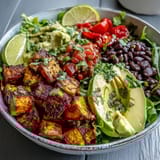 Drizzled with zesty lime dressing and garnished with cilantro for a nutritious vegetarian dinner.