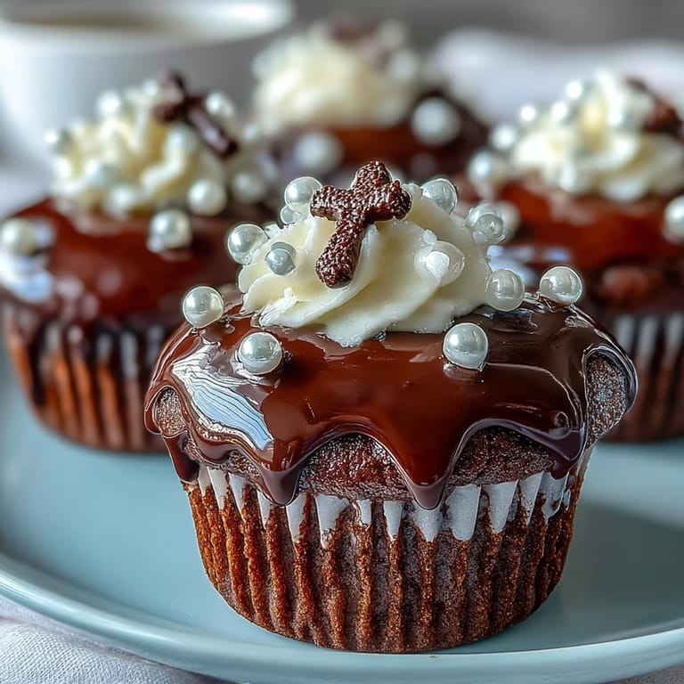Vanilla mini cupcakes crowned with elegant fondant rosary toppers, perfect for celebrating a First Communion with sweetness.