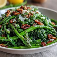Fresh shaved asparagus and pea salad with lemon dressing, bursting with spring flavors and crisp textures for a light, healthy meal.  